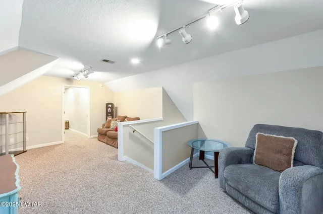 a bedroom with a bed and a with furniture