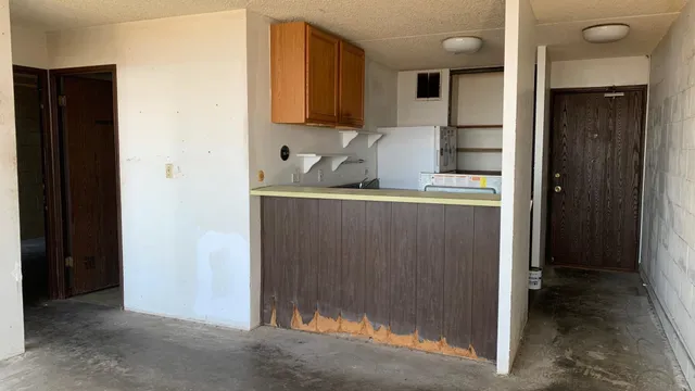 a view of a kitchen with wooden floor