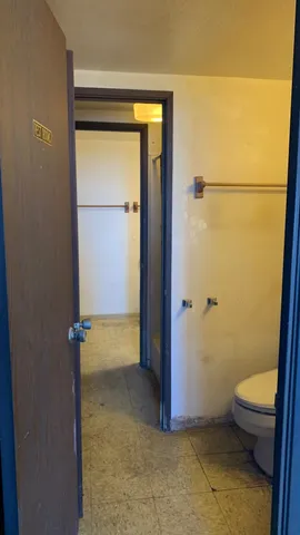 a front view of a house with a yard balcony and seating area