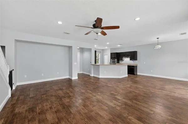a view of kitchen with a sink and microwave