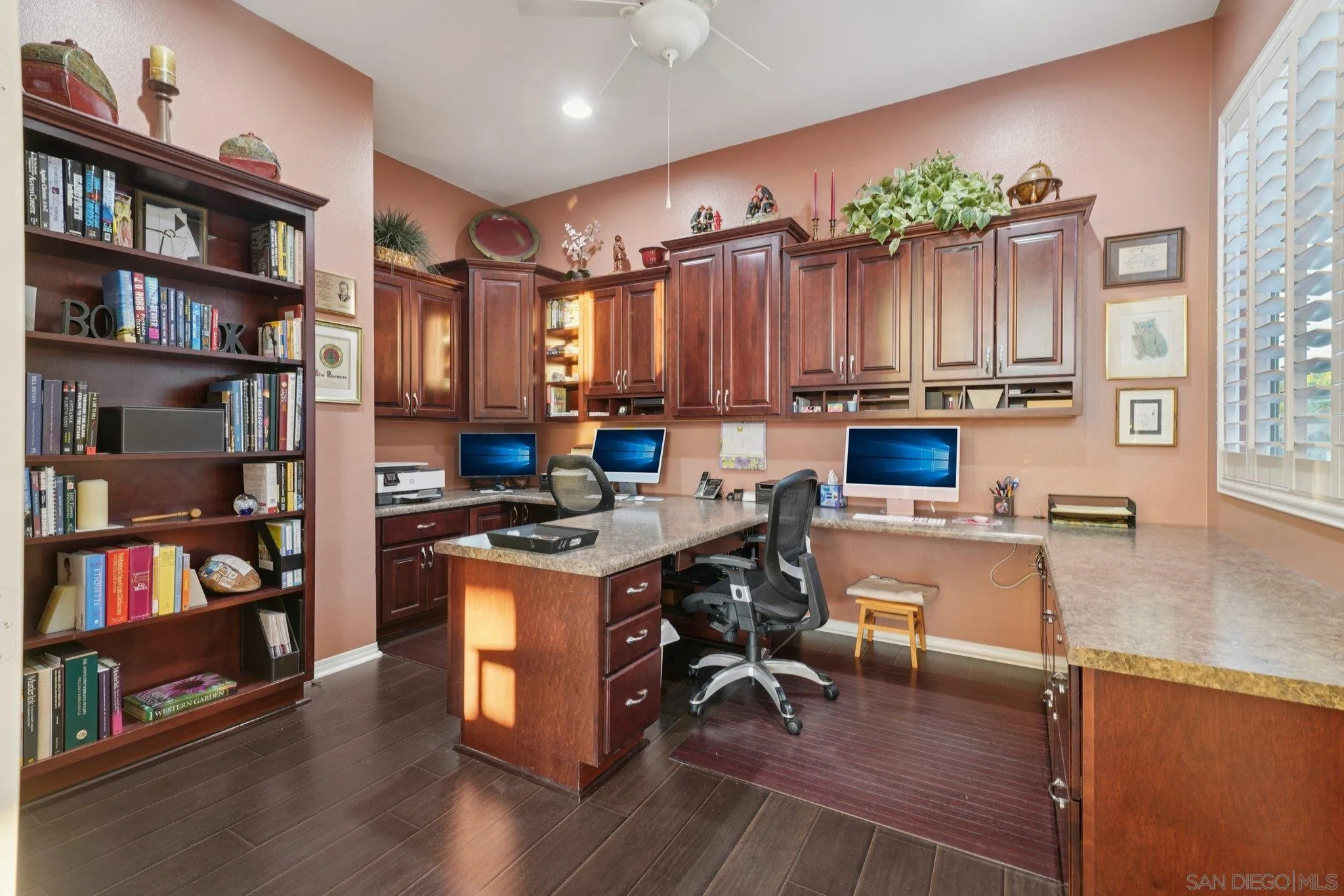 9471 Estrella Hills Street Riverside, CA 92508 - Photo 15 of 43 a open kitchen with stainless steel appliances granite countertop a table chairs and a book shelf