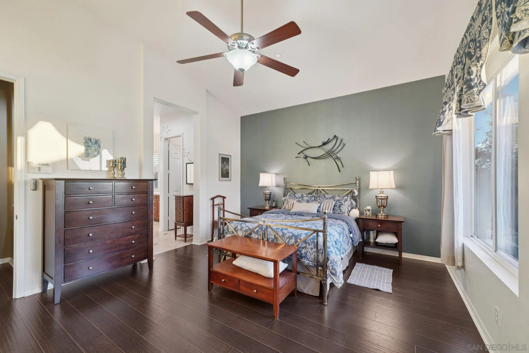 9471 Estrella Hills Street Riverside, CA 92508 - Photo 16 of 43 a bedroom with a bed and wooden floor