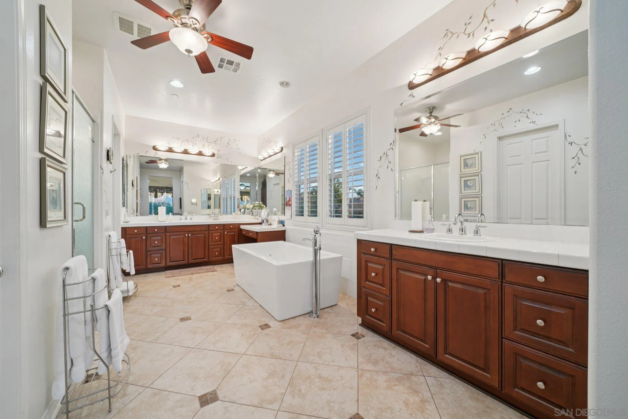 9471 Estrella Hills Street Riverside, CA 92508 - Photo 20 of 43 a large kitchen with kitchen island granite countertop a sink and a cabinets