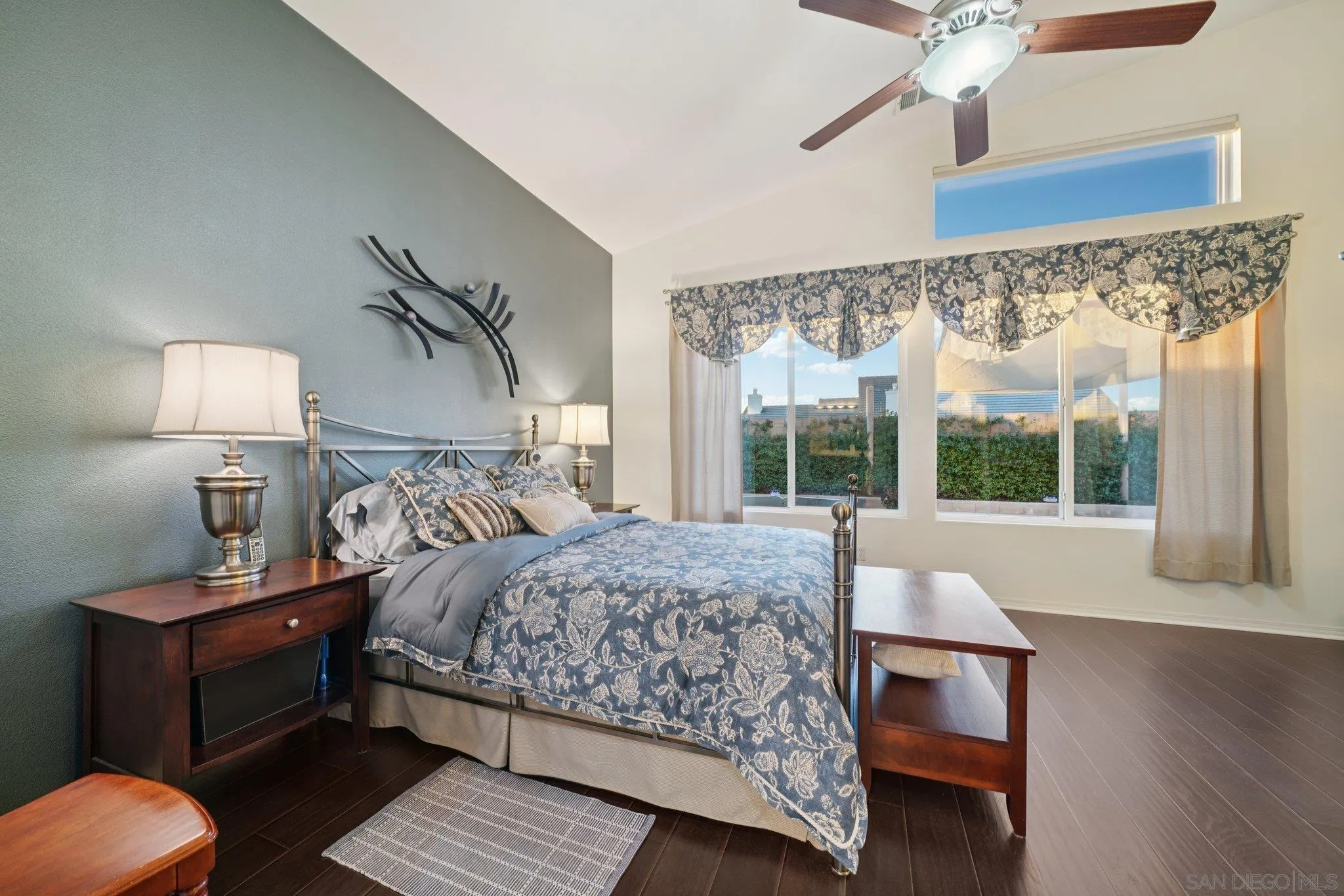 9471 Estrella Hills Street Riverside, CA 92508 - Photo 23 of 43 a bedroom with a bed and wooden floor