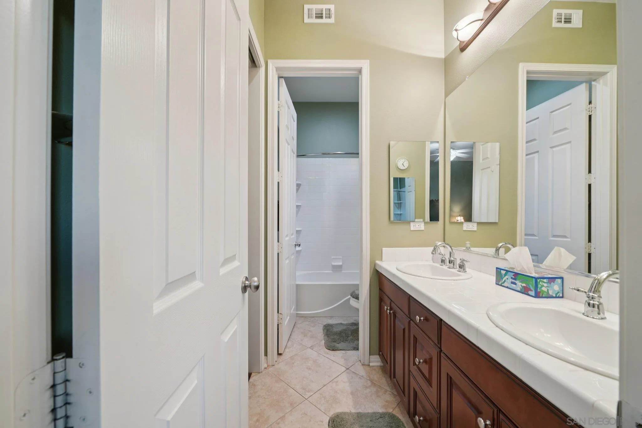 9471 Estrella Hills Street Riverside, CA 92508 - Photo 25 of 43 a spacious bathroom with a double vanity sink toilet and shower