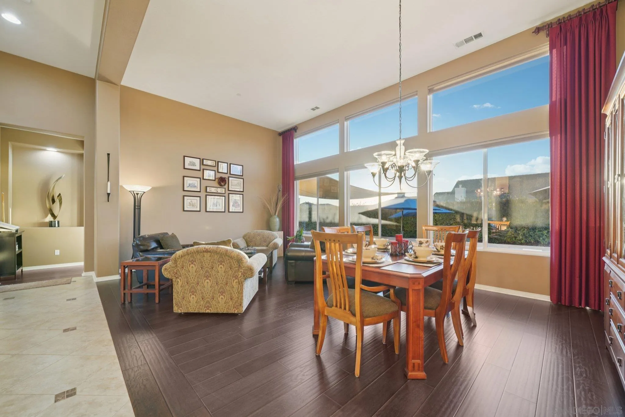 9471 Estrella Hills Street Riverside, CA 92508 - Photo 3 of 43 a view of a dining room with furniture and wooden floor