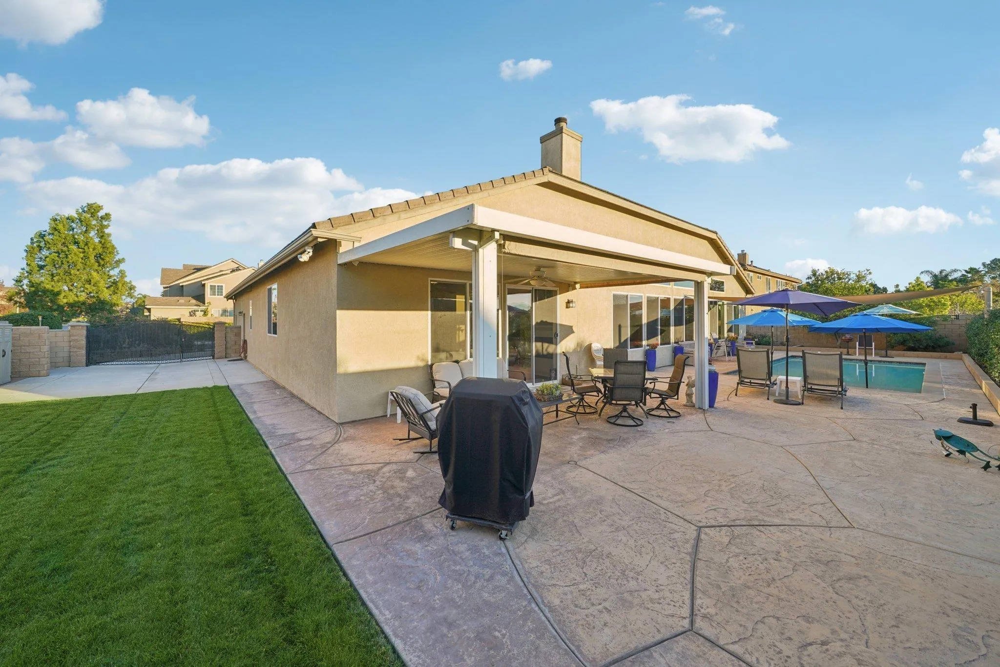9471 Estrella Hills Street Riverside, CA 92508 - Photo 35 of 43 a front view of a house with garden