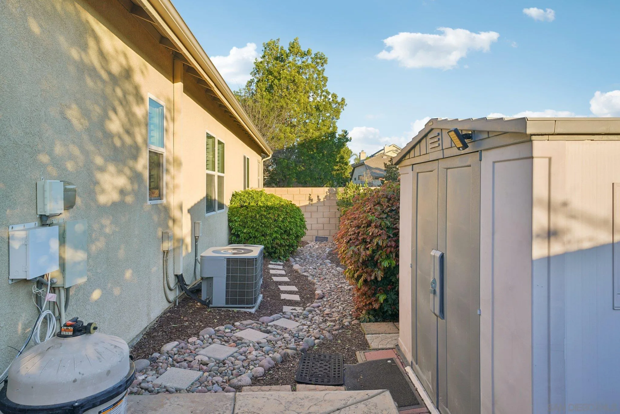 9471 Estrella Hills Street Riverside, CA 92508 - Photo 41 of 43 a view of a porch with plants and glass door
