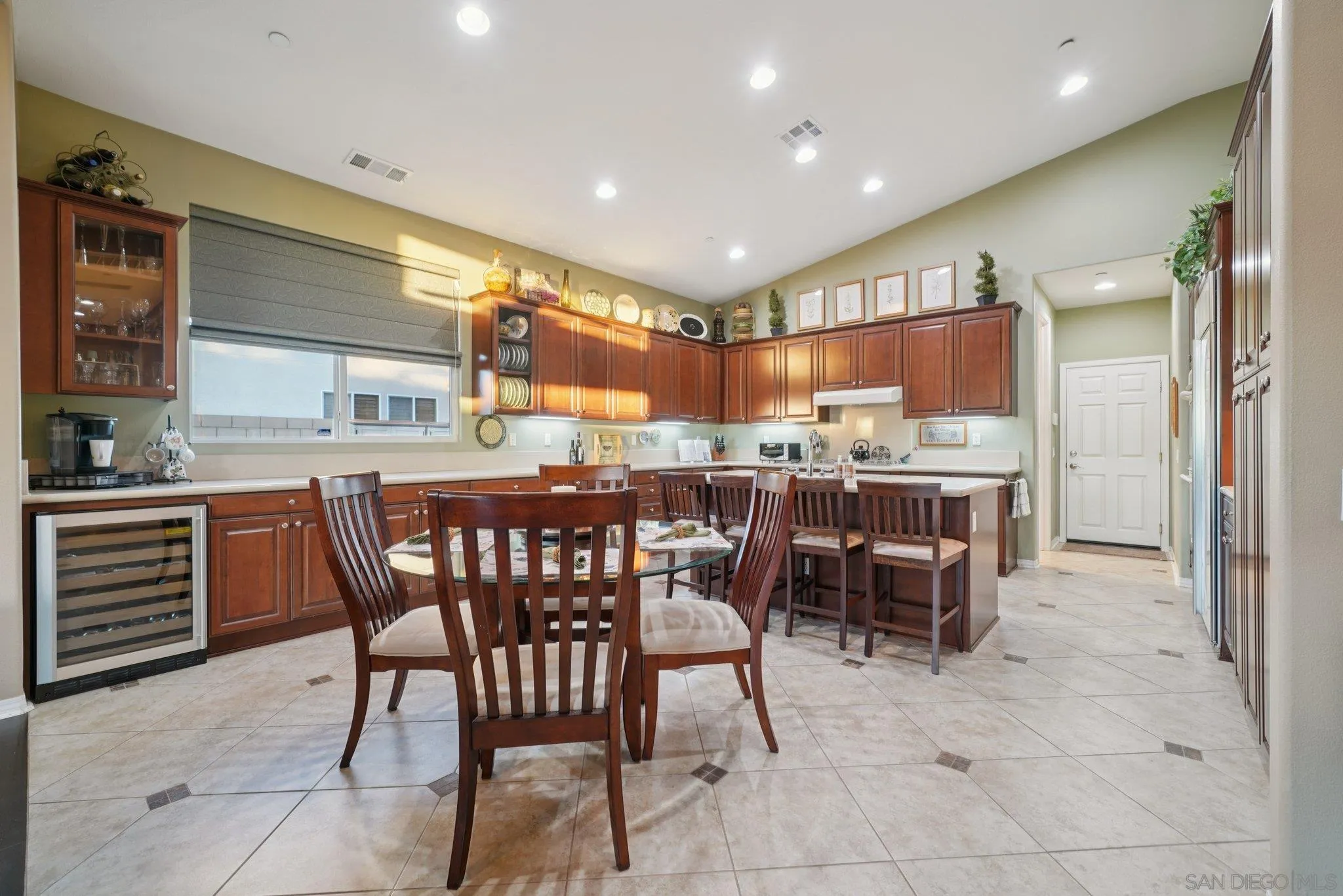 9471 Estrella Hills Street Riverside, CA 92508 - Photo 9 of 43 a kitchen with a table and chairs