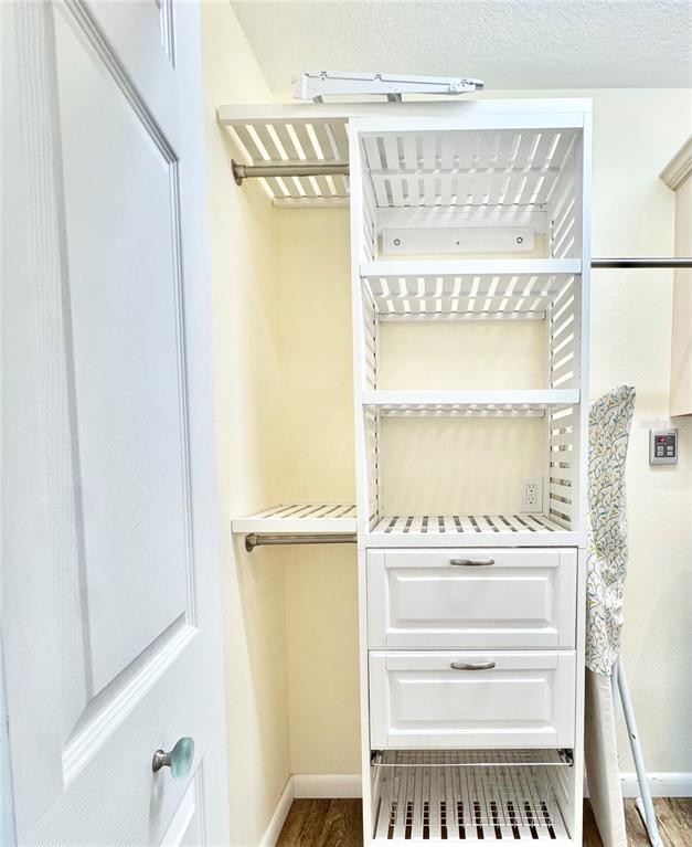 16204 3rd Street East Redington Beach, FL 33708 - Photo 22 of 58 a view of walk in closet with empty racks