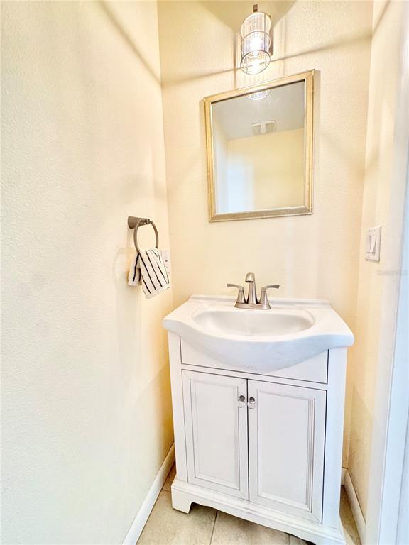 16204 3rd Street East Redington Beach, FL 33708 - Photo 23 of 58 a bathroom with a sink a vanity and a mirror