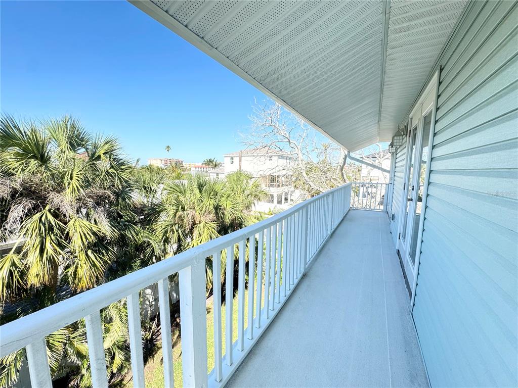 16204 3rd Street East Redington Beach, FL 33708 - Photo 24 of 58 a view of a balcony with flower plants