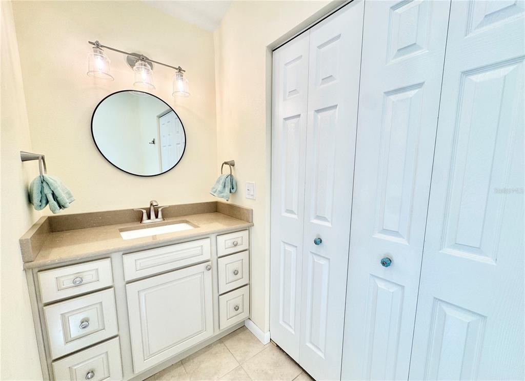 16204 3rd Street East Redington Beach, FL 33708 - Photo 32 of 58 a bathroom with a sink and a mirror