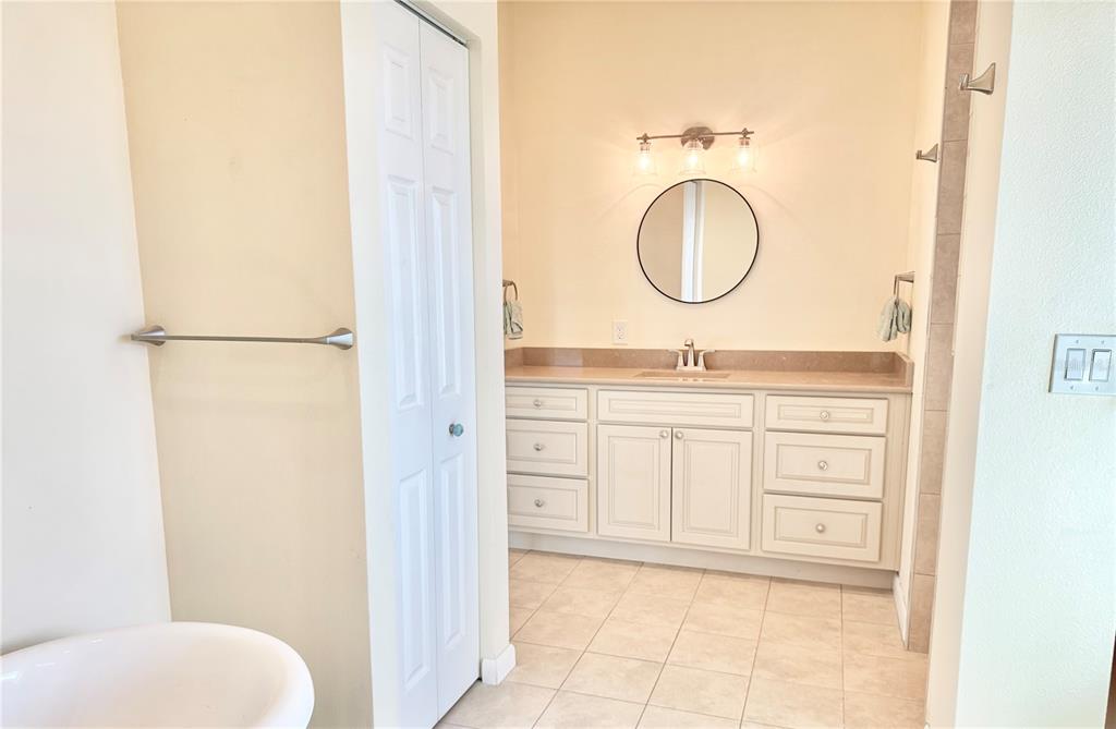 16204 3rd Street East Redington Beach, FL 33708 - Photo 33 of 58 a bathroom with a toilet a sink and a mirror