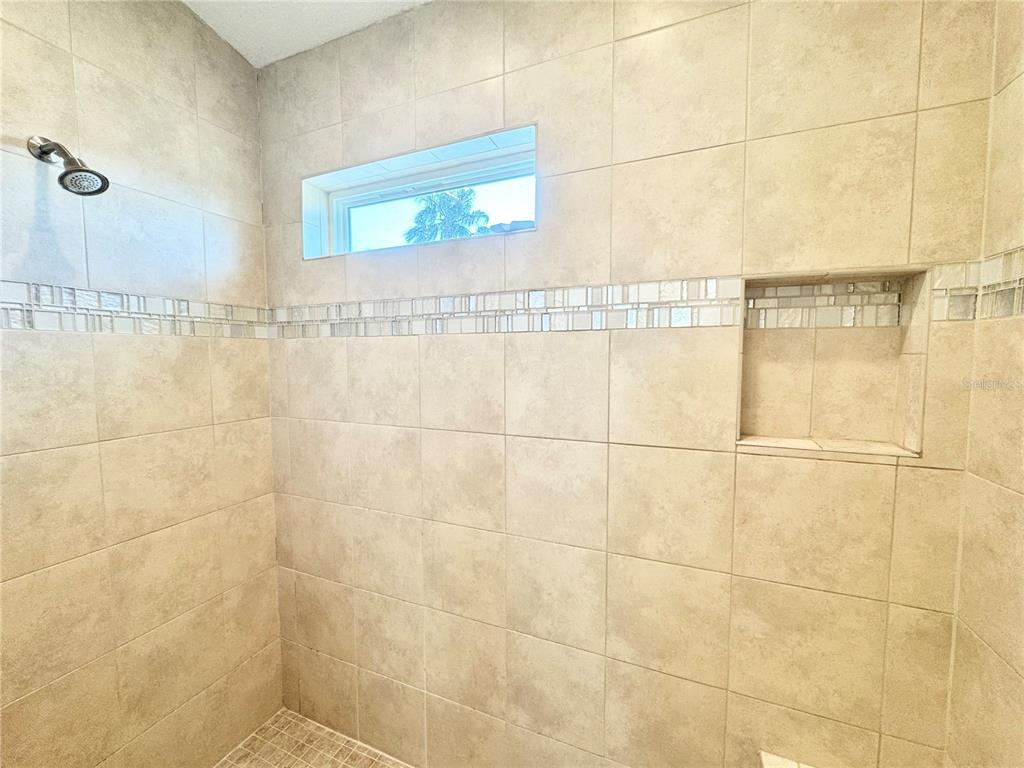 16204 3rd Street East Redington Beach, FL 33708 - Photo 35 of 58 a bathroom with a shower