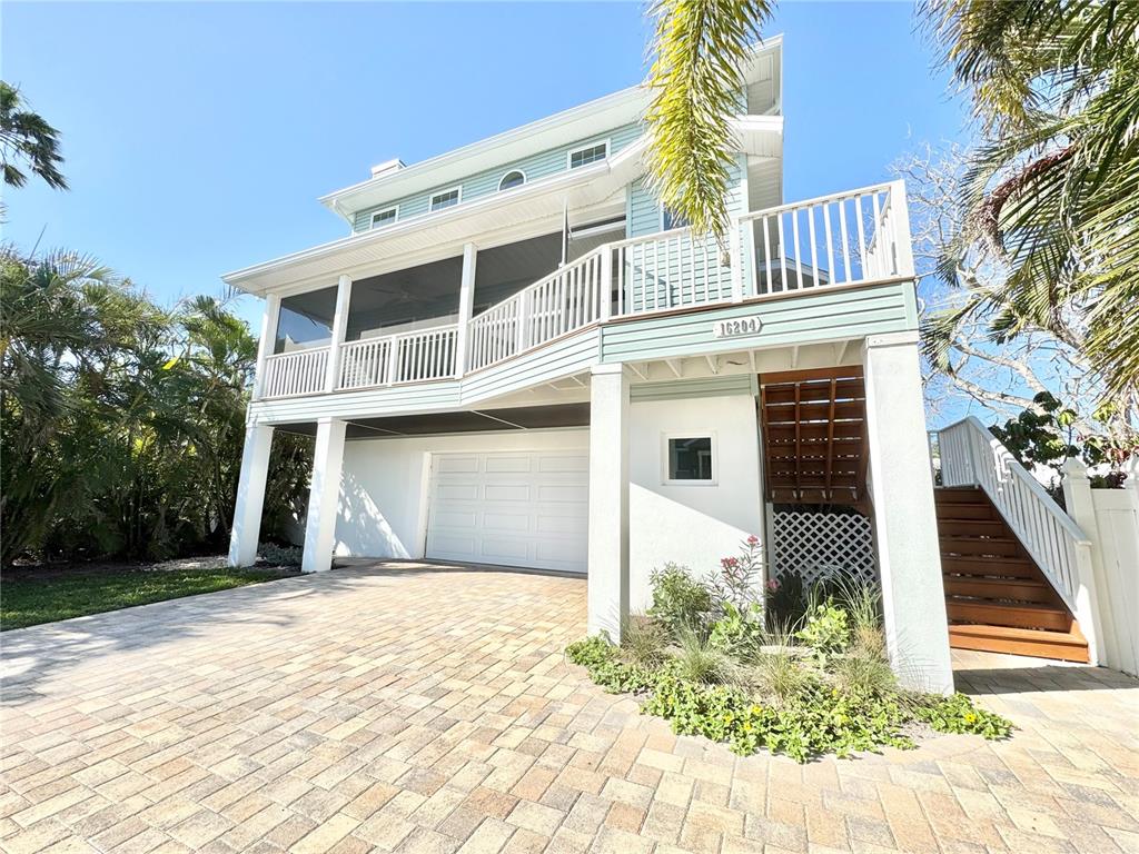 16204 3rd Street East Redington Beach, FL 33708 - Photo 4 of 58 a front view of a house