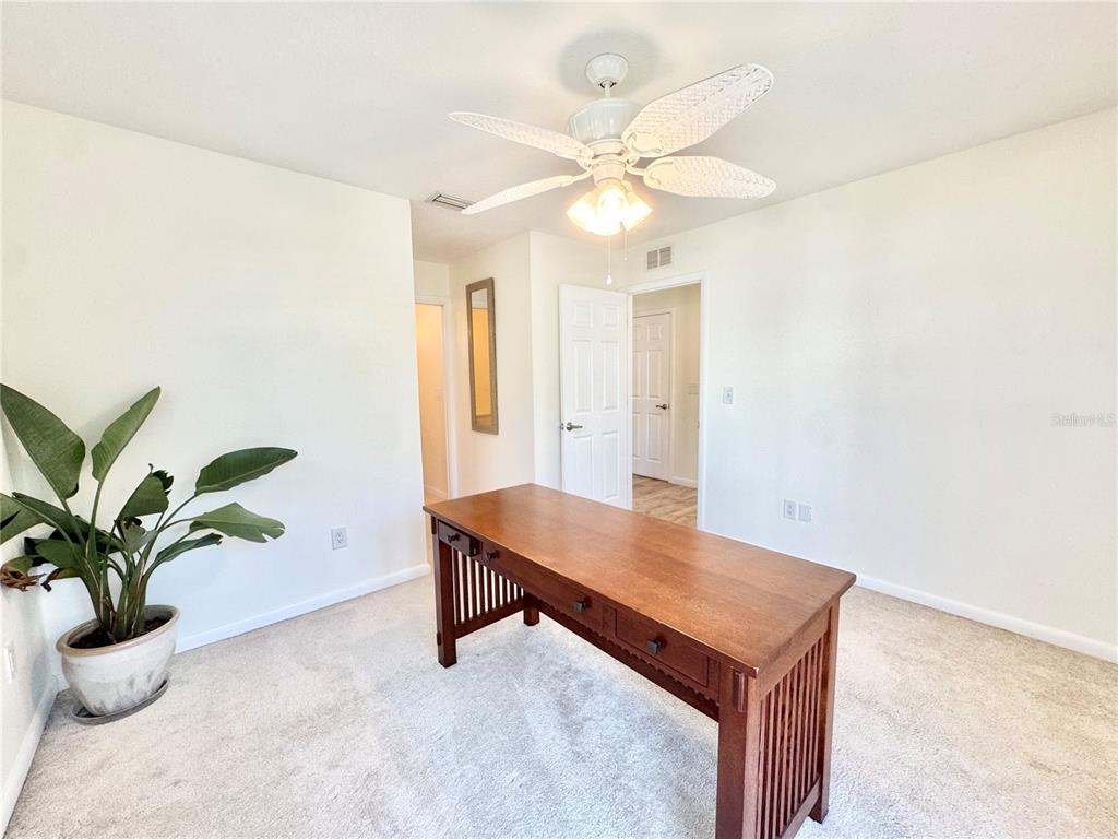 16204 3rd Street East Redington Beach, FL 33708 - Photo 43 of 58 a room with table and potted plants