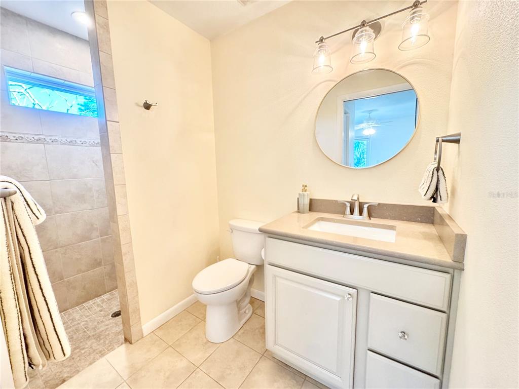 16204 3rd Street East Redington Beach, FL 33708 - Photo 44 of 58 a bathroom with a sink and a mirror