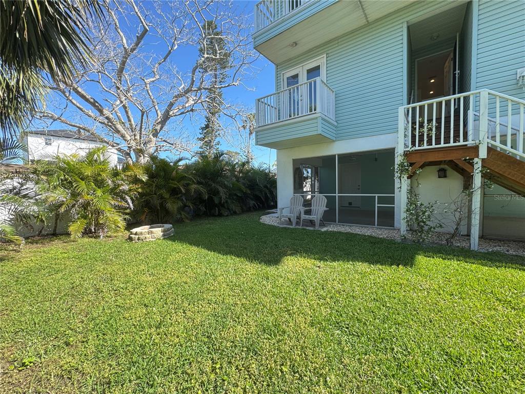 16204 3rd Street East Redington Beach, FL 33708 - Photo 49 of 58 a view of a house with a yard and sitting area