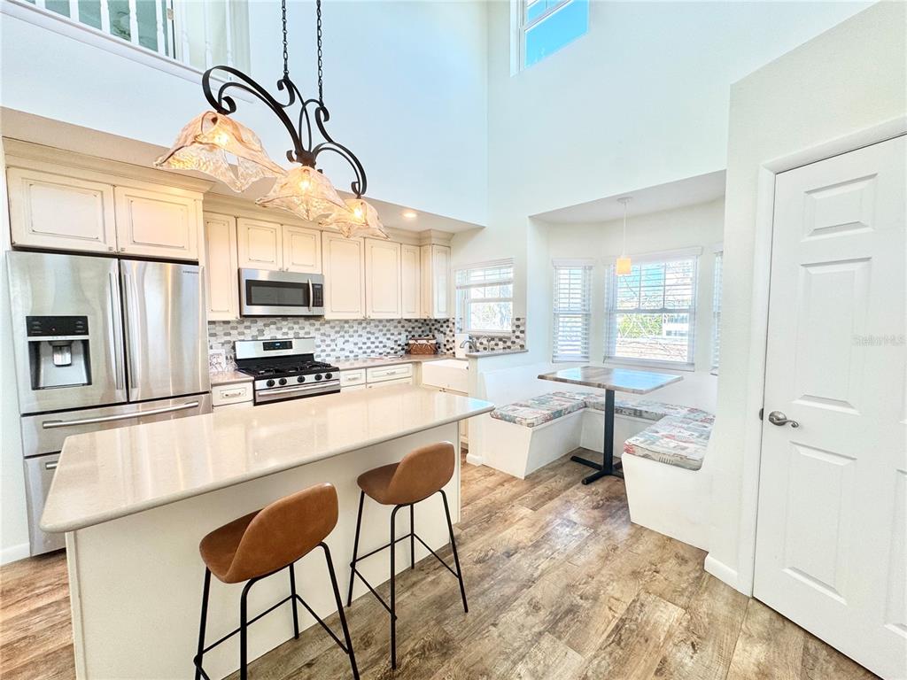 16204 3rd Street East Redington Beach, FL 33708 - Photo 10 of 58 a kitchen with stainless steel appliances a stove a sink cabinets and a refrigerator