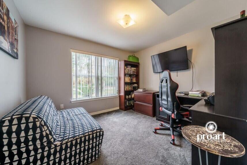 641 Bayshore Drive Destin, FL 32550 - Photo 15 of 34 a bedroom with a bed and a flat screen tv