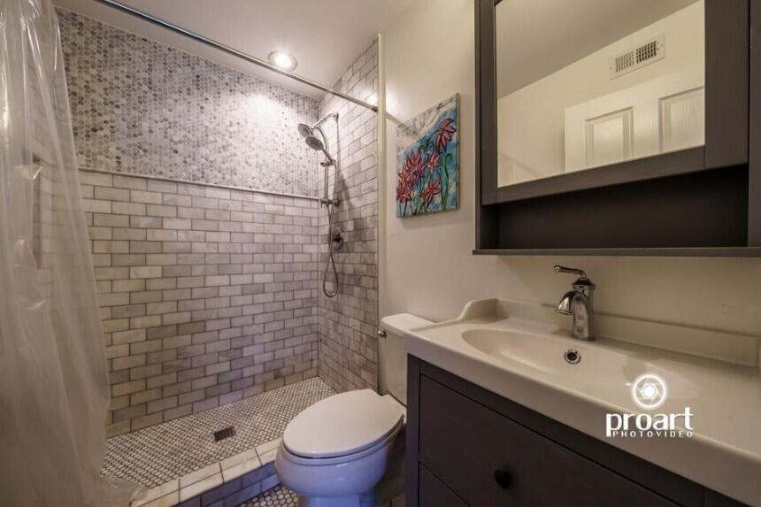 641 Bayshore Drive Destin, FL 32550 - Photo 16 of 34 a bathroom with a sink a toilet and shower