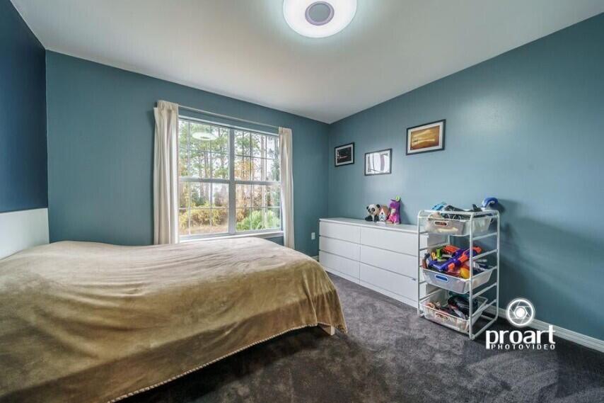 641 Bayshore Drive Destin, FL 32550 - Photo 17 of 34 a bedroom with a bed and a window