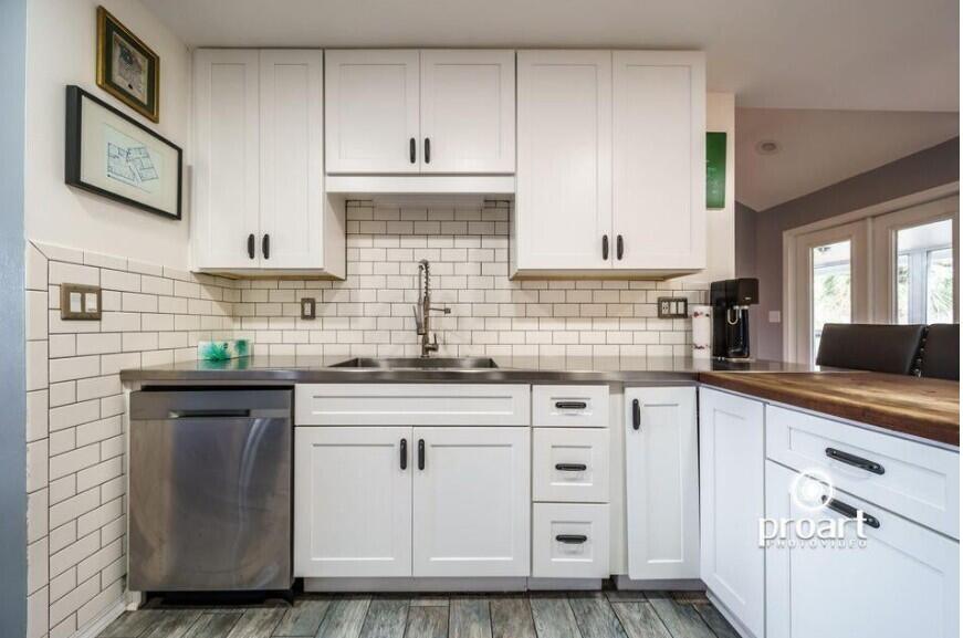 641 Bayshore Drive Destin, FL 32550 - Photo 25 of 34 a kitchen with stainless steel appliances granite countertop a sink and cabinets