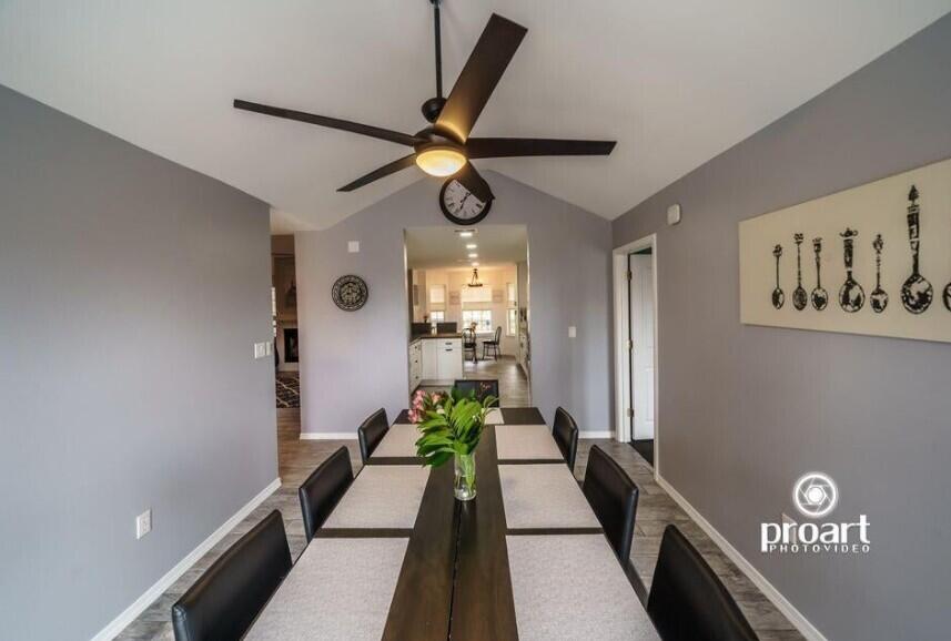 641 Bayshore Drive Destin, FL 32550 - Photo 30 of 34 a view of a hallway with wooden floor and a chandelier