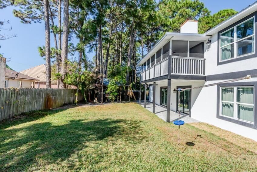 641 Bayshore Drive Destin, FL 32550 - Photo 3 of 34 a front view of a house with a yard