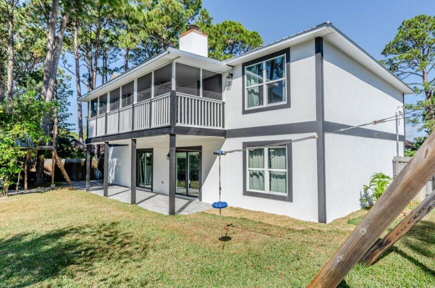 641 Bayshore Drive Destin, FL 32550 - Photo 4 of 34 a view of a house with yard and sitting area