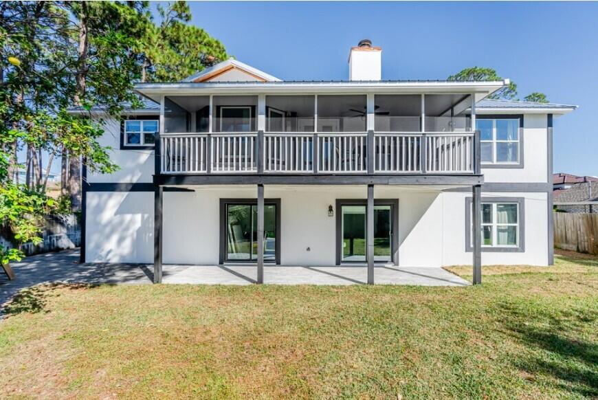 641 Bayshore Drive Destin, FL 32550 - Photo 5 of 34 a front view of a house with a yard