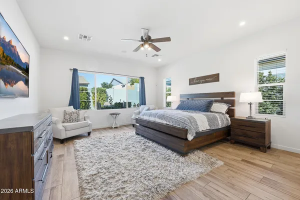 a bedroom with a large bed and a couch
