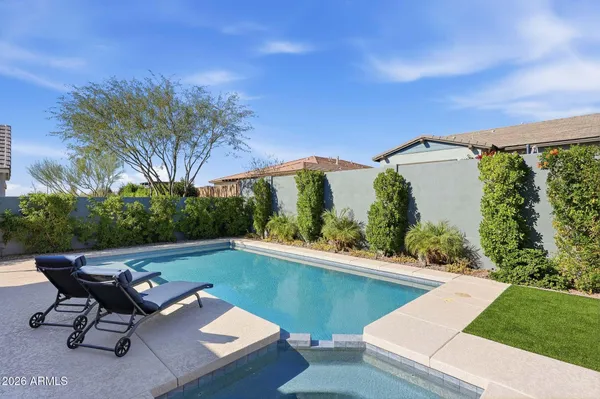a view of a patio with table and chairs and potted plants with sky view