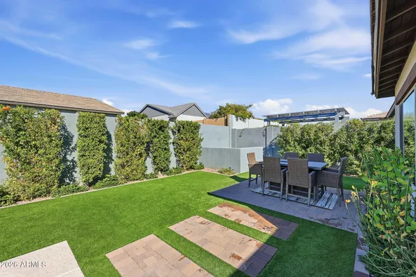 a view of a yard with a patio