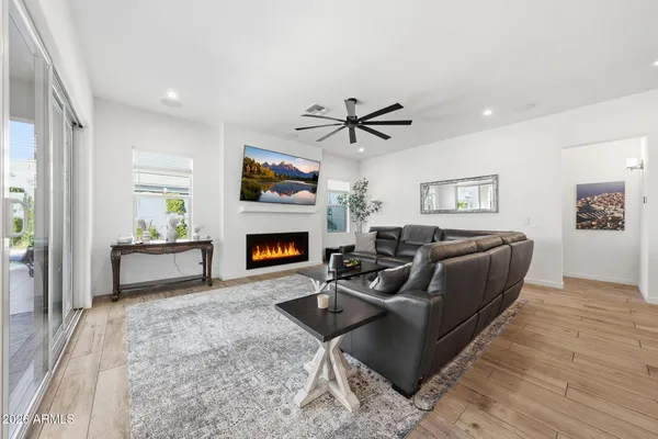 a living room with furniture and a fireplace