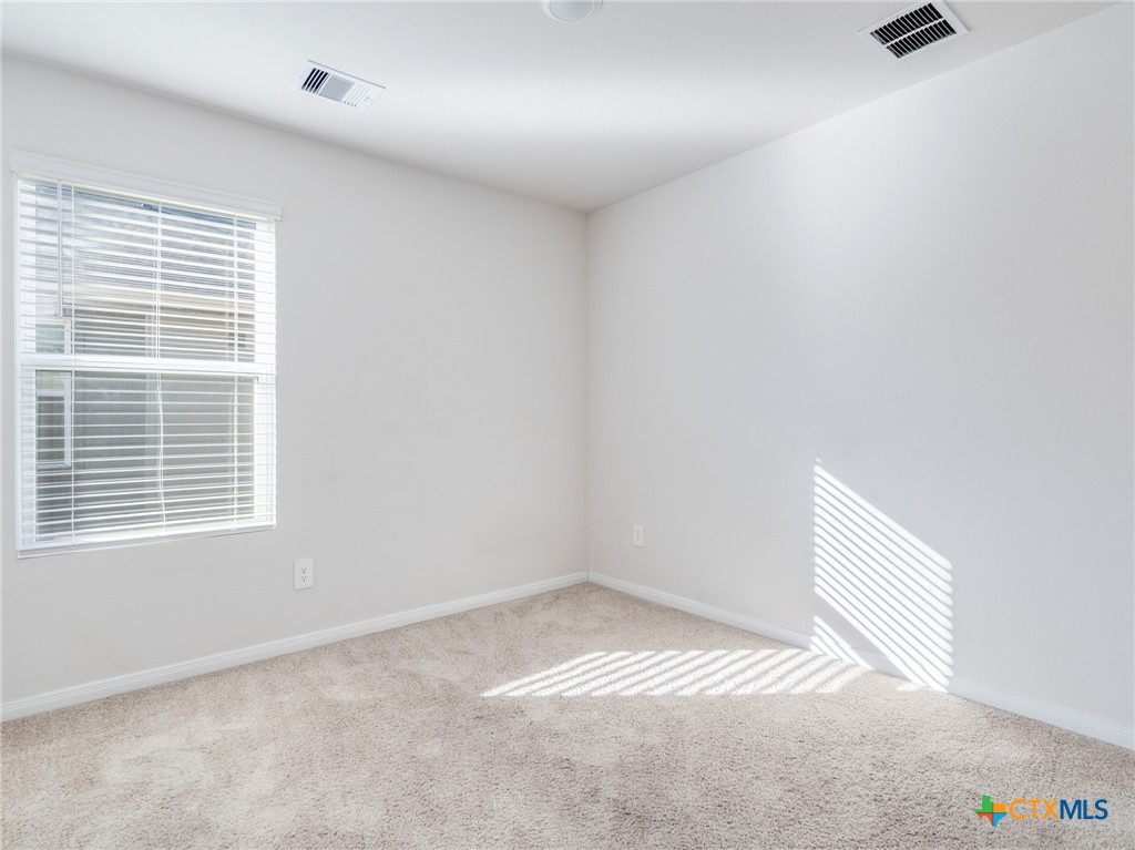 316 Addison Place Lockhart, TX 78644 - Photo 17 of 28 an empty room with a window