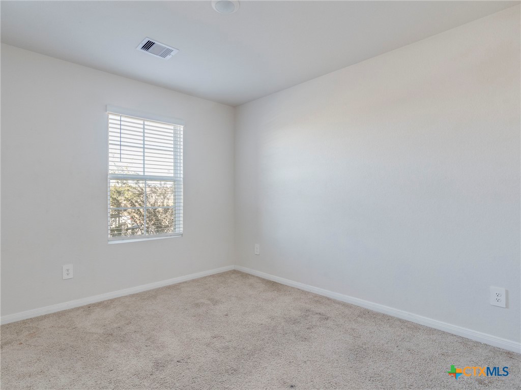 316 Addison Place Lockhart, TX 78644 - Photo 22 of 28 an empty room with a window