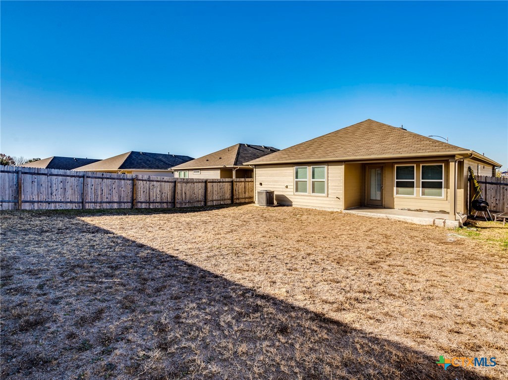 316 Addison Place Lockhart, TX 78644 - Photo 26 of 28 a front view of a house with a yard