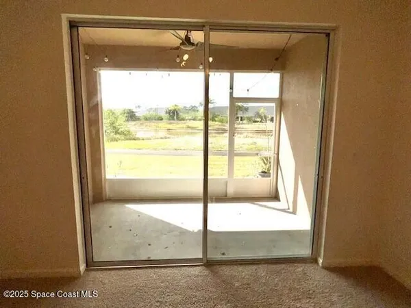 a view of an empty room and window