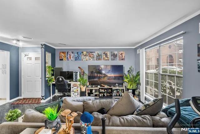 a very nice looking living room with furniture and a large window