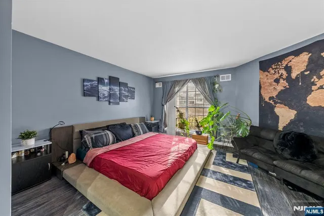 a room that has a bed and a table in it