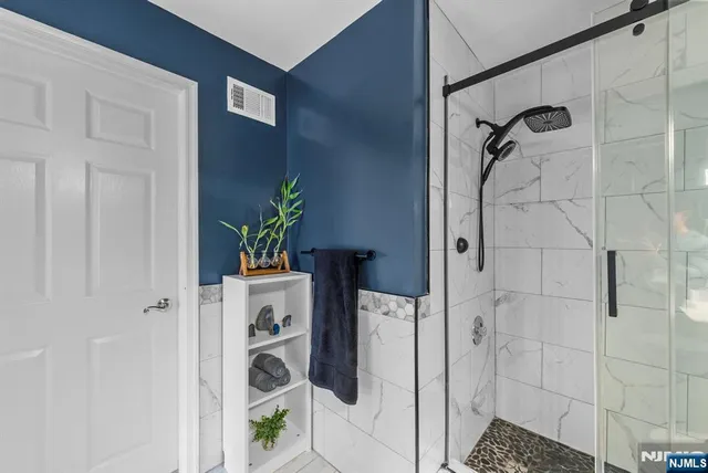 a spacious bedroom with a bed and a window