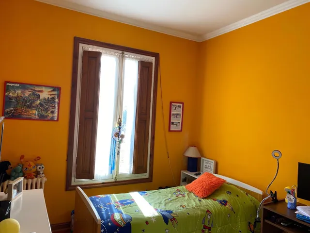 a view of a house with yard and tree s