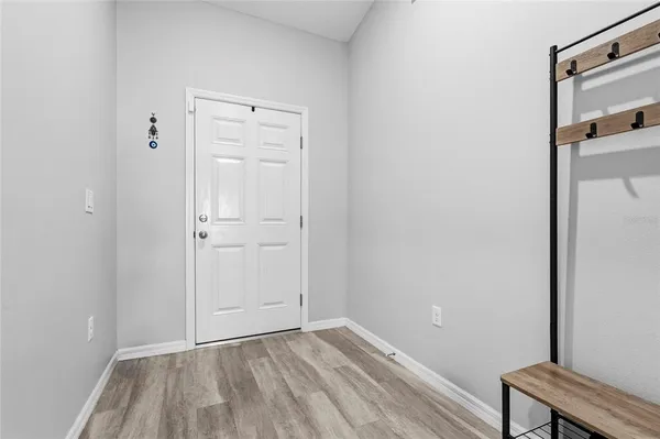 a view of a dining room with furniture and window