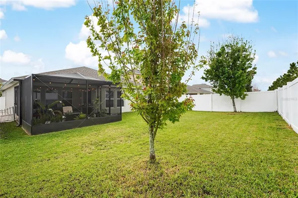 a view of a patio with a table chairs and a patio