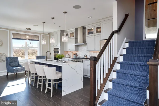 a kitchen with a sink cabinets and washer