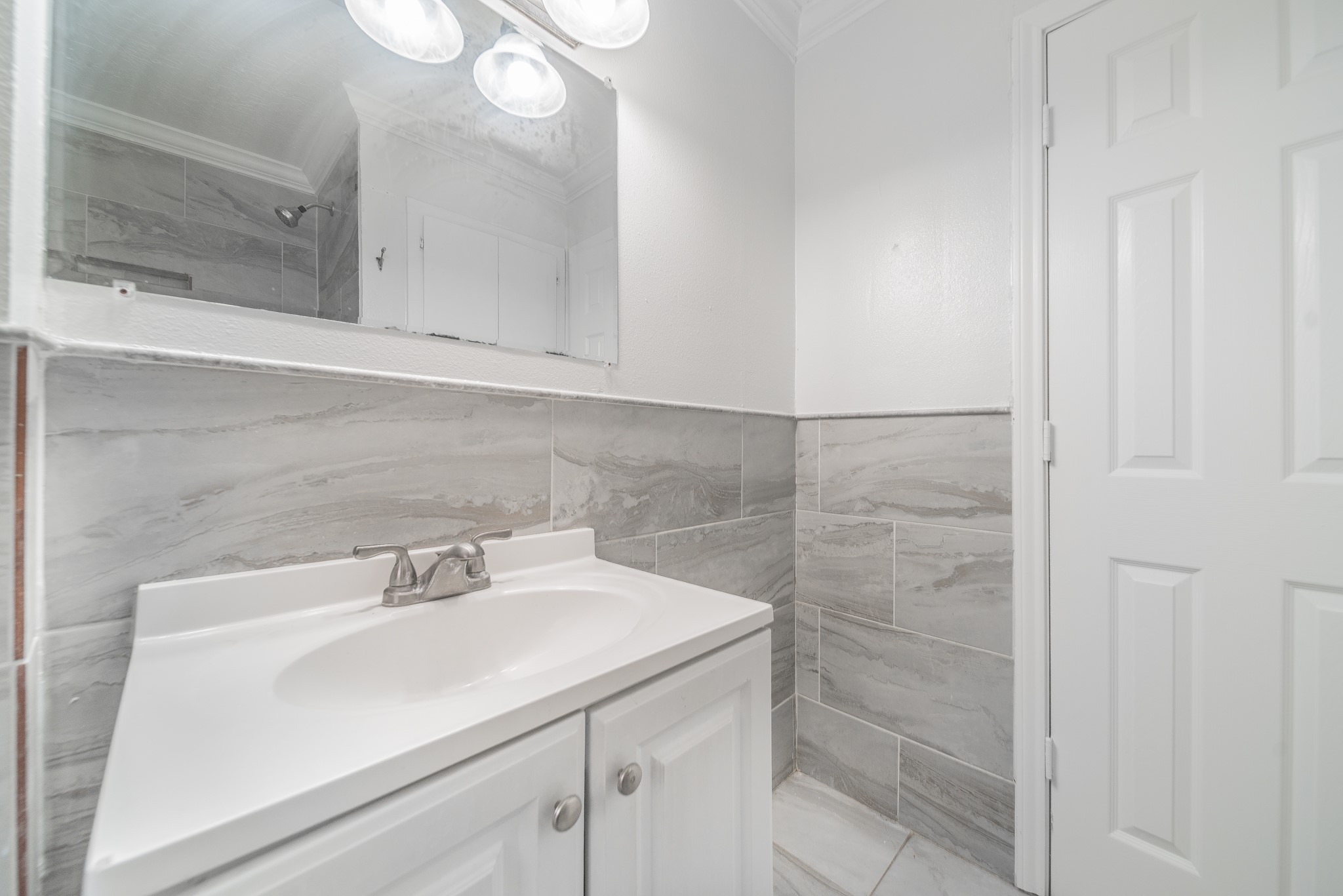 415 Gober Street Houston, TX 77017 - Photo 8 of 12 a bathroom with a sink and a mirror