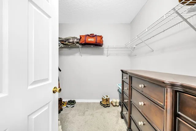 a view of storage and utility room with two washing machine