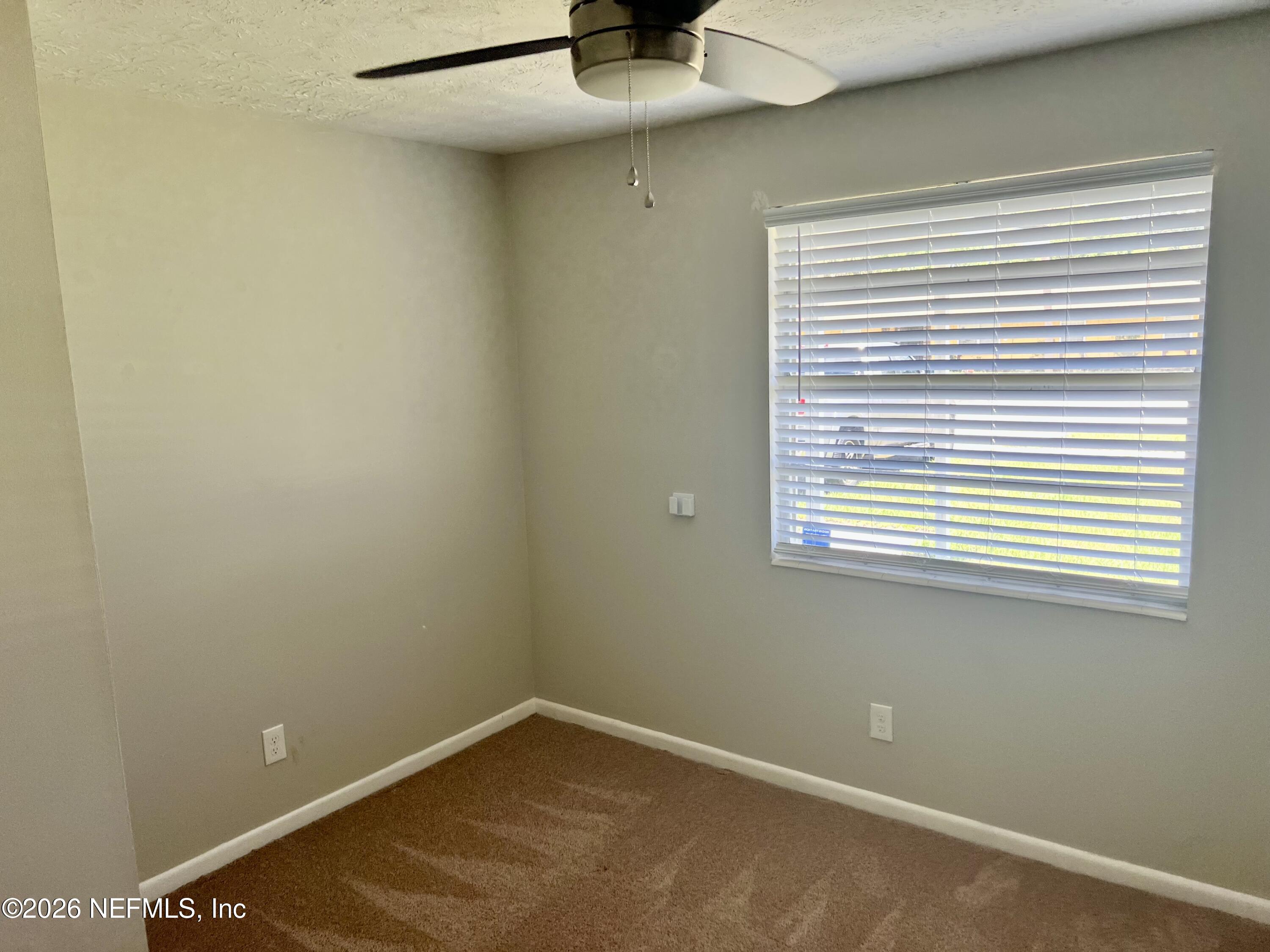 10964 Bacall Road West Jacksonville, FL 32218 - Photo 15 of 19 a view of a small space with a window